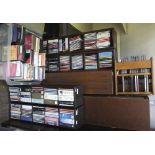 An extensive collection of classical music CDs (one box and various storage racks)