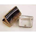 A silver mounted vesta box with polished glass panels and a further snuff box with agate panels