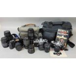 A collection of camera and photography equipment to include a Canon EOS 1000 with additional lens
