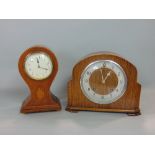 An oak balloon head mantle clock, 24 cm high, key, together with a Garrard mantle clock, key and