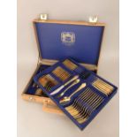 Royal Collection Solingen gold plated canteen of cutlery within a faux leather brief case, 46cm