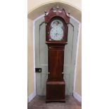 A Regency mahogany longcase clock with reeded and canted column corners, the case with flame