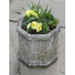 A pair of weathered contemporary cast composition stone garden planters of hexagonal form with