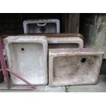 A collection of five reclaimed glazed stoneware sinks of varying size, four with stop fluted detail