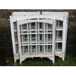 Seven reclaimed painted pine framed sash windows with segmented glazed panels