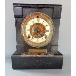 Black slate two train mantle clock, the top fitted with a bronze locomotive plaque inscribed