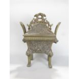 Japanese cast bronze lidded Koro with relief panels of mythical beasts in scrolled foliage with