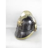 A 19th century Swedish fireman's helmet with applied brass mounts