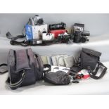 A collection of photographic equipment including a Pentax ME ASAHI, 35mm Electronic SLR camera
