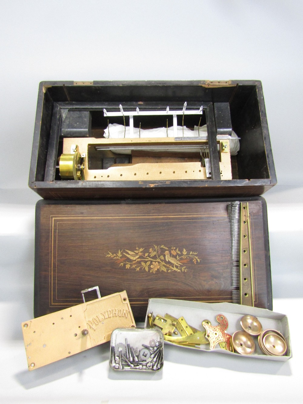 A large late 19th century rosewood music box with part fitted interior, 57cm long (for repair)