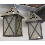 A pair of hanging porch lanterns of square form with frosted glass panels and pierced gothic trefoil