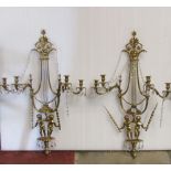 A pair of good quality polished brass wall lights in the Regency style with lyre backs, child