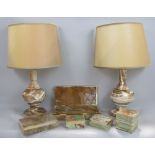 A pair of turned onyx table lamps, a large onyx cigar box, three further onyx cigarette boxes and an