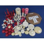 A collection of antique ivory gaming pieces to include chess sets in the manner of Calvert, dice