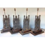 Set of four cast iron novelty table lamps in the form of Gothic buildings together with a