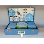 Sirram vintage picnic set, in a blue vinyl suitcase enclosing flatware plates, tupperware, etc