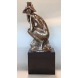 Austin Productions plaster figure of a crouched lady, dated 1971, upon a square plinth base, 55cm