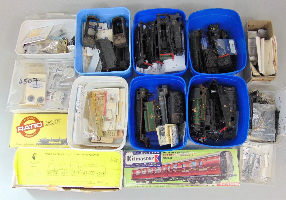 A collection of 'O' gauge components including railway engine casings, Genesis kits, Alan Gibson