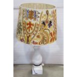 A large plaster table lamp of baluster form with massive 1970s hand painted shade