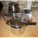 A stainless steel fish kettle, various saucepans, Tower Pressure cooker, etc