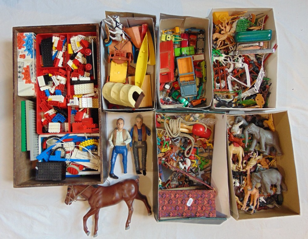 A collection of vintage toys including a box of Lego with Britains long wheel base Land Rovers,