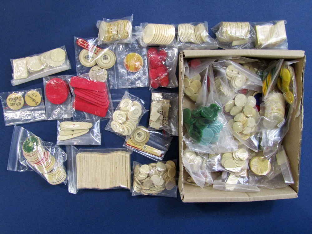 A box containing a large quantity of ivory and other gaming tokens