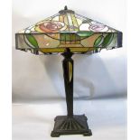 Tiffany & Co style table lamp, the leaded glass shade with art nouveau foliage upon a tapered square