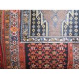 Persian runner decorated with geometric medallions, upon a blue ground, 340 x 105cm, with further