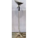 A vintage floorstanding standard lamp, with possibly associated adjustable domed shade, raised on