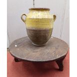 An 18th century terracotta pot partially glazed and with loop handles together with simple pine