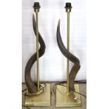 A pair of novelty table lamps with simple tubular stems and rectangular platform bases with