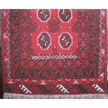 Chinese wool rug with dragon decoration, upon an orange ground, 170 x 90cm, together with a small