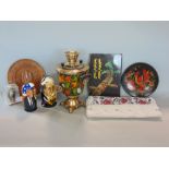 A collection of Russian items to include an ebonised painted samovar, novelty Russian dolls after