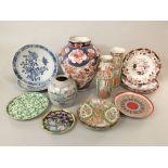 A collection of oriental ceramics including a large lamp base in the imari manner, two Cantonese
