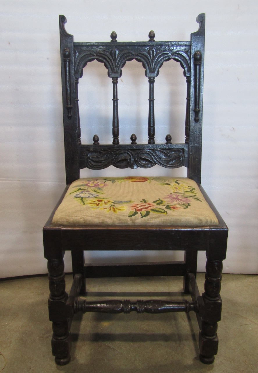 A single Yorkshire oak side chair with simple mouldings and carved detail and hand worked tapestry