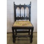 A single Yorkshire oak side chair with simple mouldings and carved detail and hand worked tapestry