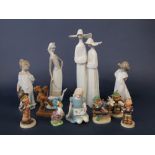 A Lladro figure group of a pair of nuns, further Lladro figure group of a Goose girl, two Nao