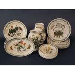 A collection of Portmeirion Botanic garden wares comprising two vases, an oval dish, twelve dinner