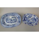 An early 19th century meat plate with blue and white printed chinoiserie decoration and impressed