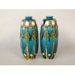 A pair of early 20th century Minton Secessionist vases with yellow stylised wheatear decoration on a