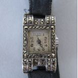 Ladies Art Deco cocktail watch set with marcasite on silver, sunburst dial with Arabic numerals,