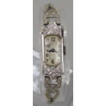 9ct white gold and diamond set ladies cocktail watch, the rectangular dial with Arabic numerals,