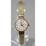 Longines ladies 9ct cocktail watch, the champagne dial with Arabic numerals 12, 3, 6 and 9 and