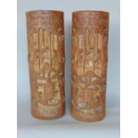 Large pair of Chinese carved bamboo brush pots, decorated with figures amongst bamboo gardens,