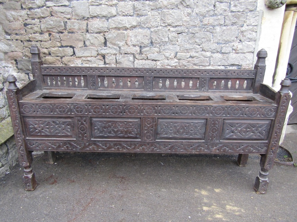 19th century Indian hardwood side stand, the front elevation with repeating geometric carved detail,