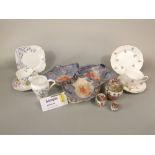 A collection of art deco tea wares with floral detail comprising milk jug, ten tea cups, twelve