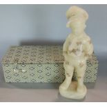 A Chinese cased soapstone study of a standing boy with shibayama type detail, the boy standing