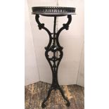 A 19th century torchere raised on three scrolled supports with acanthus and other detail, the