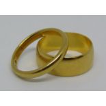 Two 22ct wedding rings, sizes G & H, 5.6g gross (2)