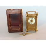 Good quality gilt brass carriage clock, the architectural case with filigree work and turned